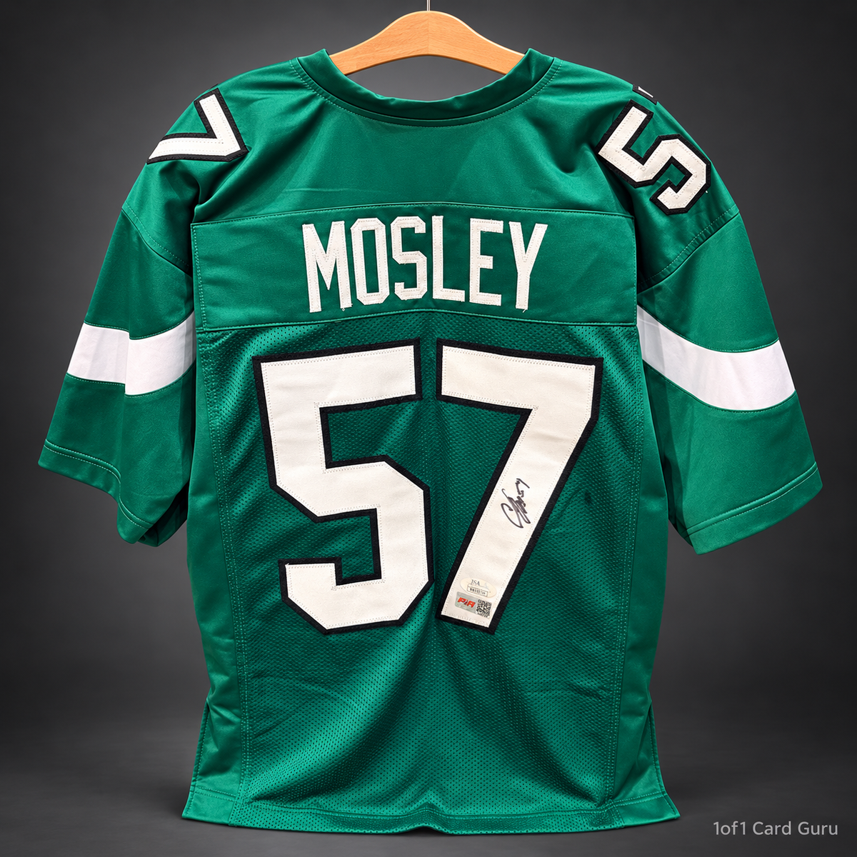 Studio-background back view of C.J. Mosley signed green number 57 jersey